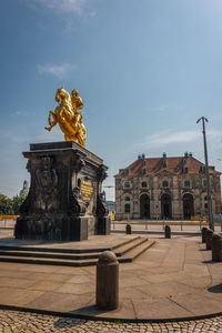Statue of historic building against sky