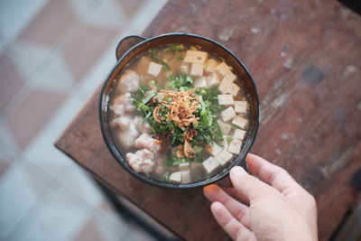 High angle view of person holding food