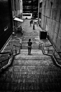 High angle view of woman walking in city