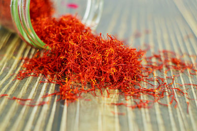 Close-up of red chili peppers on table