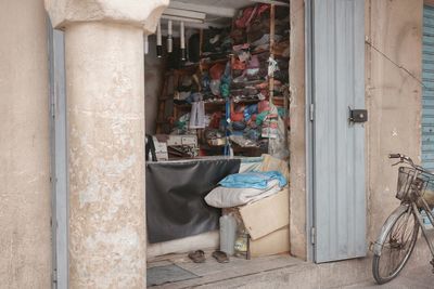 Rear view of woman sitting on street