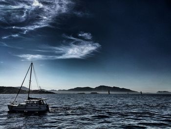 Sailboat sailing on sea against sky