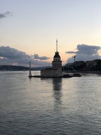 View of building by sea against sky during sunset kiz kulesi