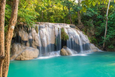 Wonder waterfall in deep forest at erawan waterfall national park.