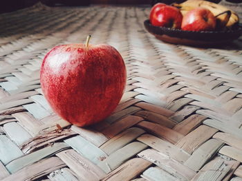 Close-up of apples in plate on table