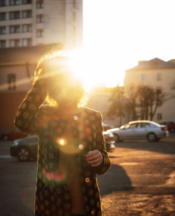 Man standing on street in city