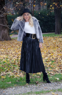 Woman standing in park during autumn