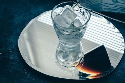 High angle view of drink in glass on table