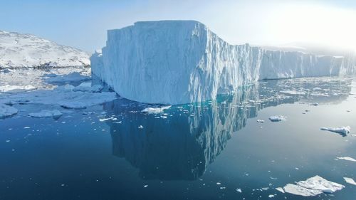 Scenic view of frozen lake against sky