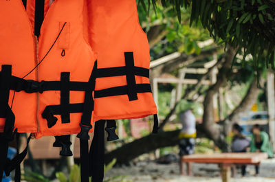 Close-up of cross hanging on wood against temple