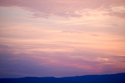 Low angle view of silhouette landscape against sky during sunset