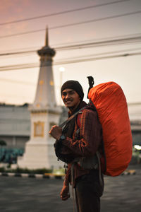 A man with backpack in yogyakarta icon