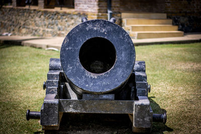 Close-up of cannon on grass