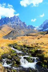 Scenic view of snowcapped mountains against sky