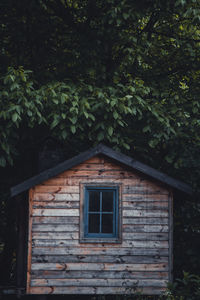 Wooden bungalow is on the top of hill at sunset