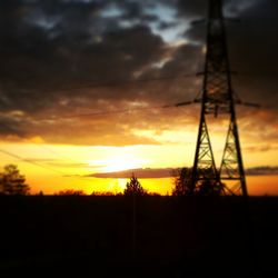 Silhouette trees against sky during sunset