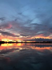 Scenic view of lake against romantic sky at sunset