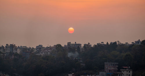 Cityscape against sky during sunset