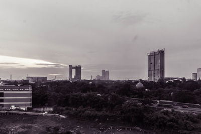 Buildings in city against sky