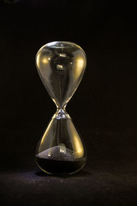 Close-up of clock on sand