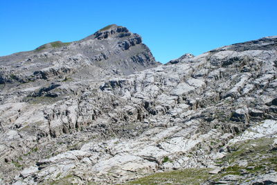 Scenic view of mountains against clear blue sky