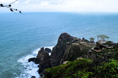 Scenic view of sea against cloudy sky