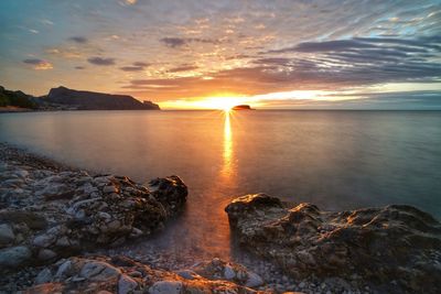 Scenic view of sea against sky during sunset