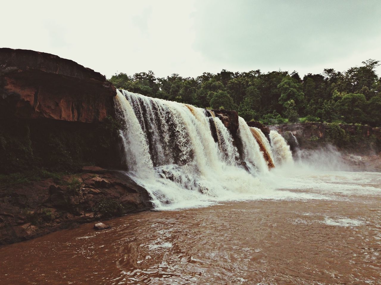 water, waterfall, motion, flowing water, long exposure, flowing, beauty in nature, scenics, rock - object, surf, splashing, nature, power in nature, blurred motion, rock formation, idyllic, sky, river, environment, day