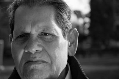 Close-up portrait of senior man outdoors