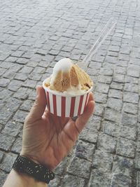 Midsection of person holding ice cream cone