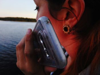 Close-up of man holding smart phone