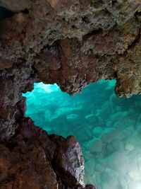 High angle view of rock formation in sea