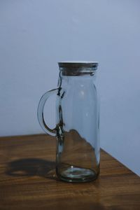 Close-up of glass jar on table