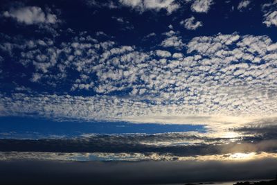 Low angle view of clouds in sky during sunset
