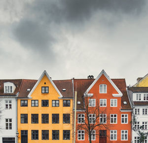 Houses in city against sky