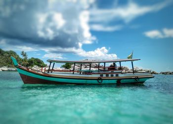 Boat in sea against sky