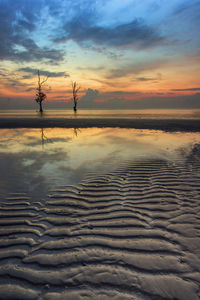 Scenic view of sea against sky during sunrise