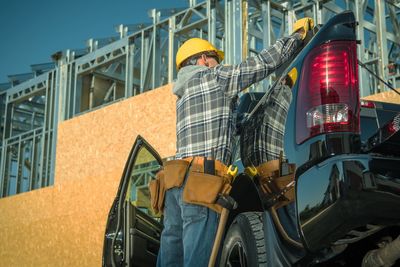 Low angle view of man building truck