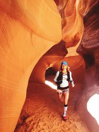 Woman standing on rock formation