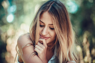 Close-up portrait of a smiling young woman