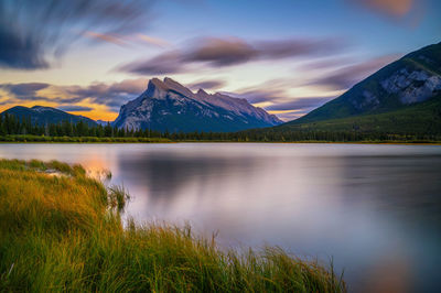 Scenic view of lake and mountains against sky