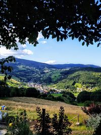 Scenic view of landscape and mountains against sky