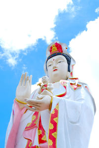 Low angle view of statue against sky