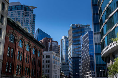 Low angle view of skyscrapers against sky