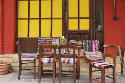 Empty chairs and tables in building