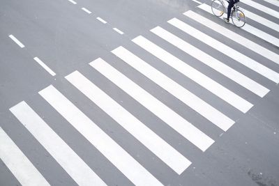 Low section of person crossing road