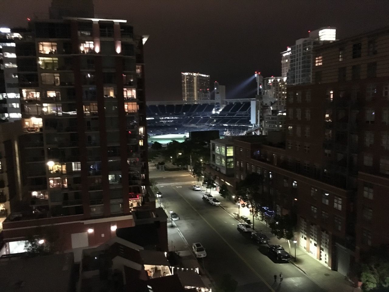 HIGH ANGLE VIEW OF ILLUMINATED CITY STREET