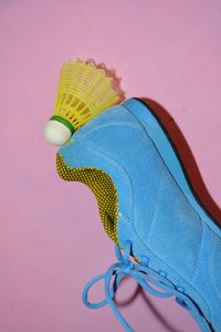 Low section of person against pink background