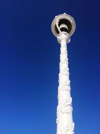 Low angle view of tower against clear blue sky