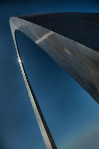 Low angle view of modern building against blue sky